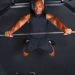 Man Lifting Weights on Bench Press Burning Calories During Workout